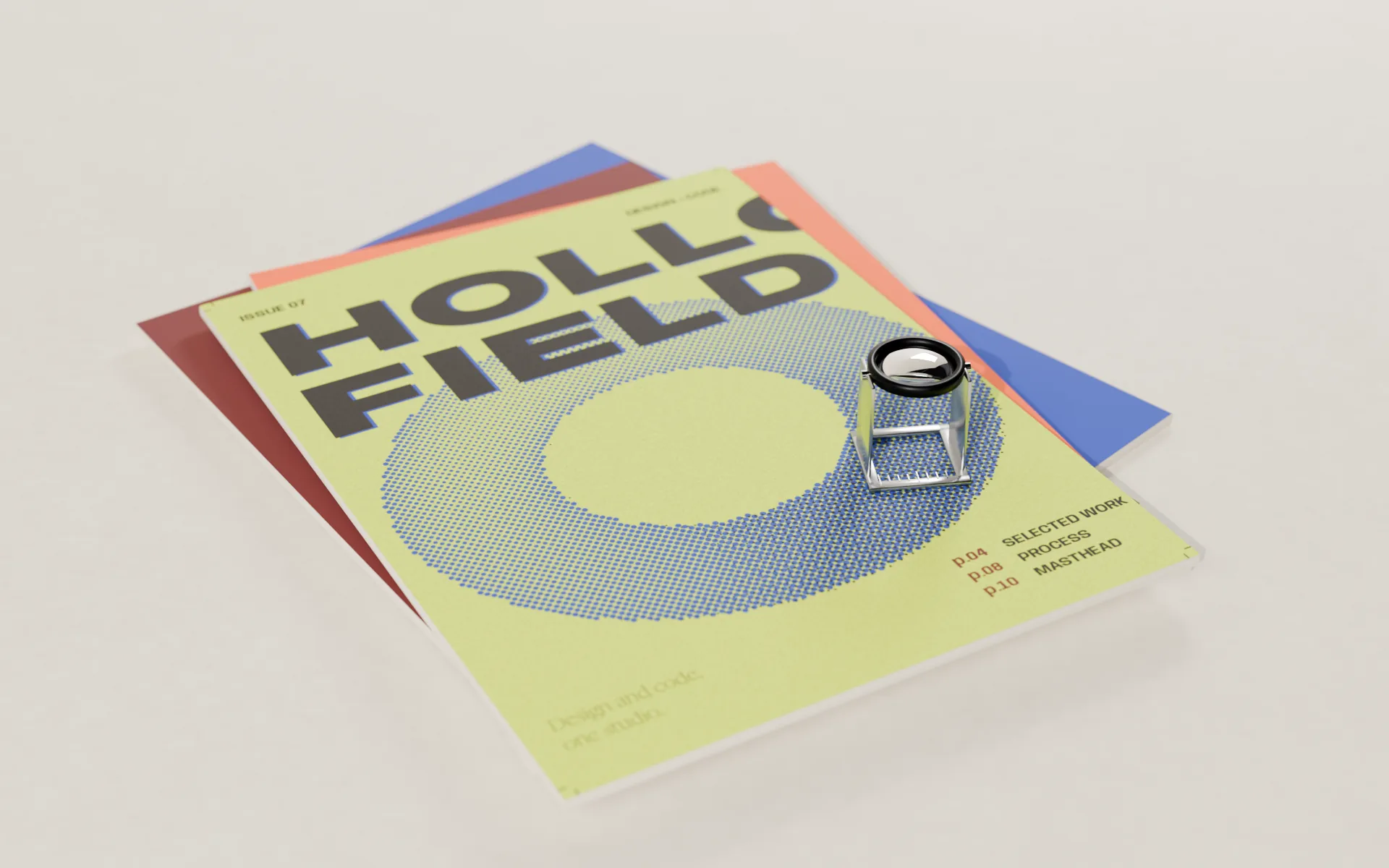 Copies of Issue 07 on the studio desk in window light, the folding linen tester resting on the cover.