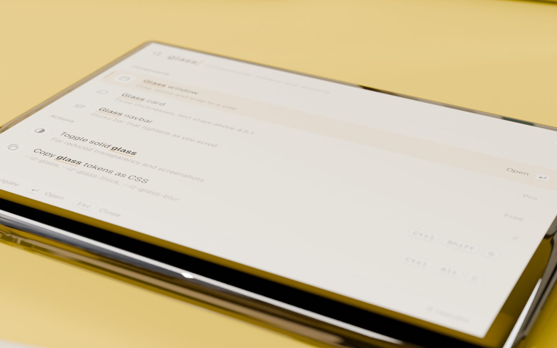 The command palette slab lying on the lemon desk, searching “glass”: polished edges, the UI printed on its face.